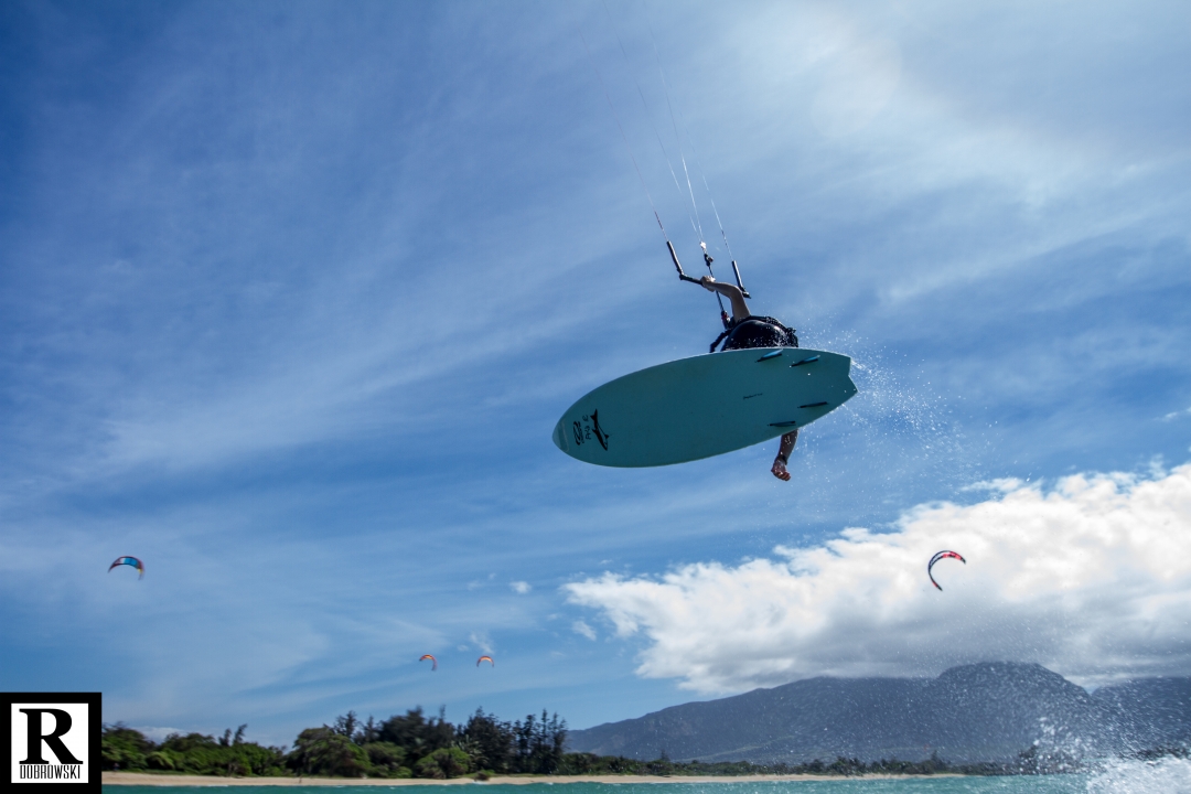 Boosting over Kite Beach, Maui, kites and the West Maui Mountains behind. Photo: Rick Dobrowski